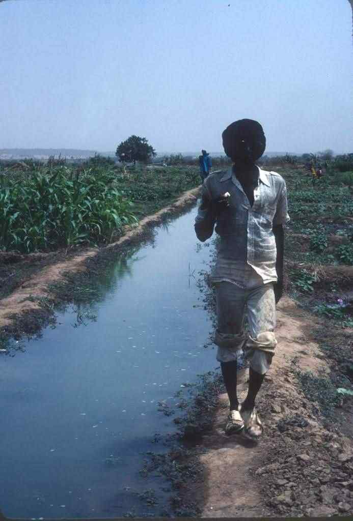 Amadou Demba walks the canal banks